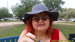 Nurse Vicki Smoking in the Park on a Bench All Dressed up