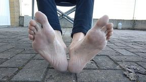 Showing my feet and soles outdoors