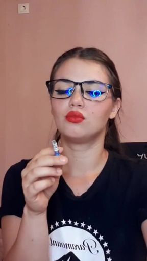 Unforgettable moment from &quot;Sensual brunette smoking and wearing geek glasses&quot;