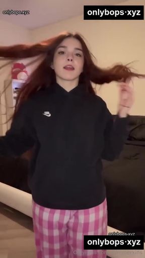 Girl in pajamas with hair blowing in the wind