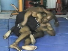 Black wrestlers get done grappling and go down on a hard bone