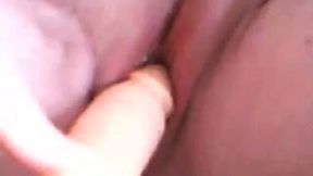 Wanton chick fucks her pierced shaved pussy with her sex toy