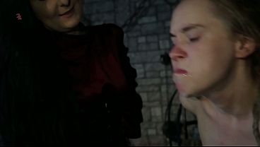 A vile witch girl is tied up and made to spit and drool by using a feather and with spanking (complete scene)