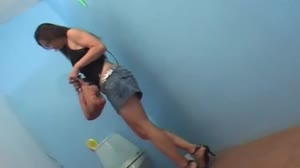 The toilet a horny brunette gets a surprise