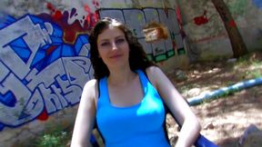 Hot brunette gives a blowjob in a park