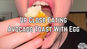 Eating Avocado Toast With Egg Close Up