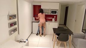 Latina brunette eats banana in the kitchen and sucks a big cock