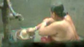 Amateur ugly Indian fatso tries to take a shower right outdoors