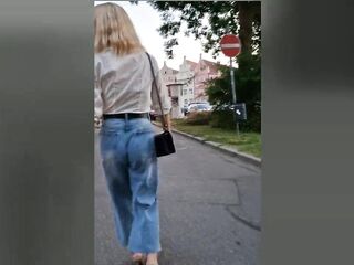 Public wetting in the midst of the town! Tgirl walking with juicy jeans!