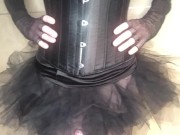 Tranny in a corset and stockings slap her dick like crazy