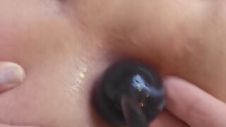 Boy receives anal beads and fingering from partner