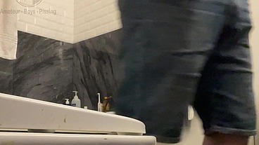 Amateur Boy in Jeans Shorts with Big Hanging Balls Caught Pissing Hands Free