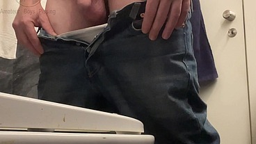 Amateur Boy in Jeans Shorts with Big Hanging Balls Caught Pissing Hands Free