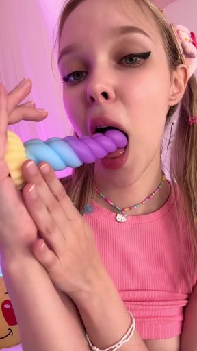 Toy in Mouth with an Innocent Stare