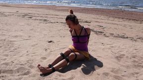 Sofi tied with black ropes on the shore of the Sunny Bay_ Part 1