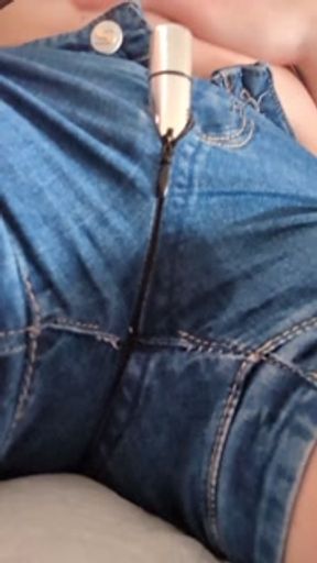Masturbating with vibe in jeans while desperate to pee. Wetting and orgasming.