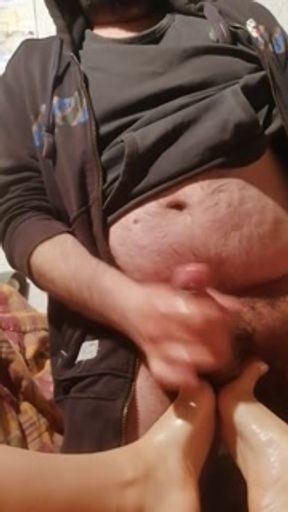 Footjob to a fat guy  with cum