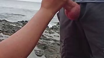 Slutty woman gave a deep blowjob to a horny stranger, while they were alone on the beach