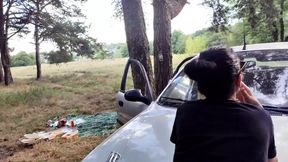 Intimate Moments by a Vehicle in a Wild Setting