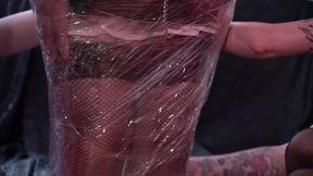 Two amazing Mistress put the maid in stocks &mdash;  insert a bougie into his urethra and wrap it with cling