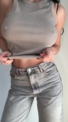 Busty E-cup girl drops her top for a surprise reveal