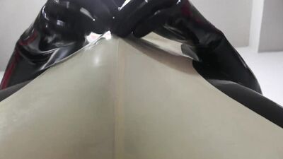 Sissy in Latex is rubbing his dick in this BDSM video