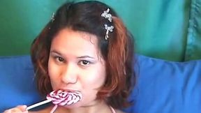 Curvaceous ginger babe sucks lollipop and masturbates