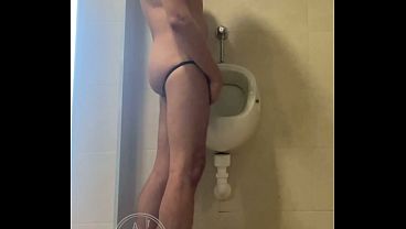 Dared his flatmate to expose his hot smooth butt at the pool'_s public toilets urinal