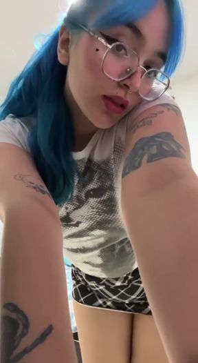 Curvy blonde in blue shirt takes selfies alone