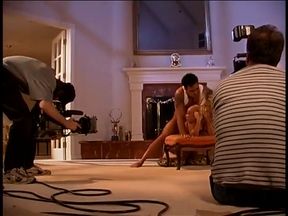 Behind the scenes footage of a camera crew filming a porn movie