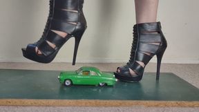 Giantess Lily Kink toy car crush of a 1950s Ford street coupe in big high heels Close ground view