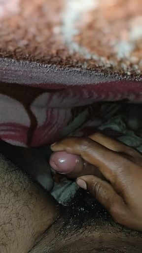 Big Boss massaging penis oil under the blanket