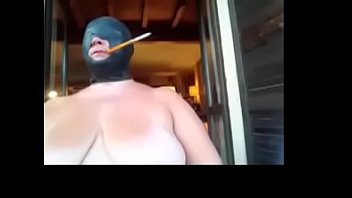 Slut wife bound, hooded and smoking with holder even outdoors