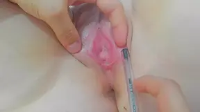 opening her lips and putting a pen in her pussy