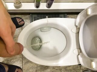Dude pees uncut shlong in lavatory