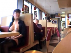 Busty babe flashing in a restaurant