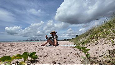 Curvy MILF exposes hairy snatch at public beach