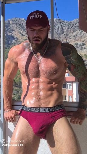 Muscular dude flexing and jerking