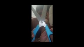A giantess sneezes in her sewing workshop and plays with giant scissors.