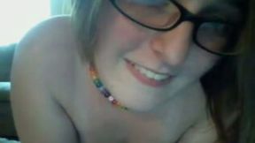 Yummy boobies of one webcam nerdy chick in glasses