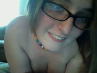 Yummy boobies of one webcam nerdy chick in glasses