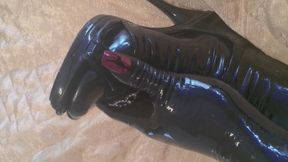 Crossdresser in rubber play