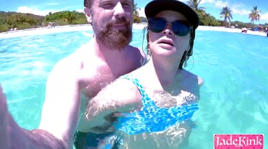 Blue-eyed blonde in a bikini sneaks an underwater creampie with her boyfriend at a crowded beach and almost gets caught by swimmers