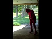 red zentai jerking off at garage door