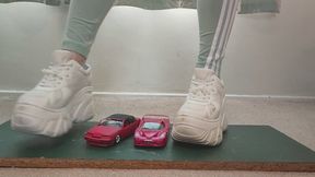 Giantess Lily Kink toy car crush of Ferrari vs 1990 Cougar XR7 in big chunky trainers sneakers and stomping the bits in a box close ground view