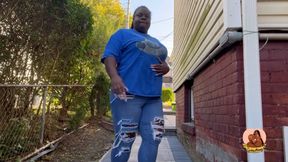 Farting in blue jeans outdoor