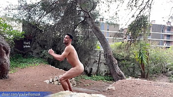 Perfect fitness body man doing naked squats in public