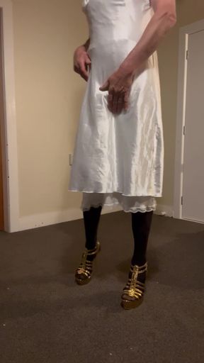 Sexy striptease down to a white bustier