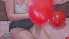 filling the room with heart-shaped balloons