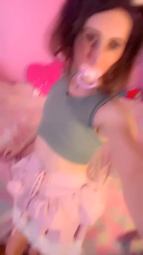 Diapered babe wets herself